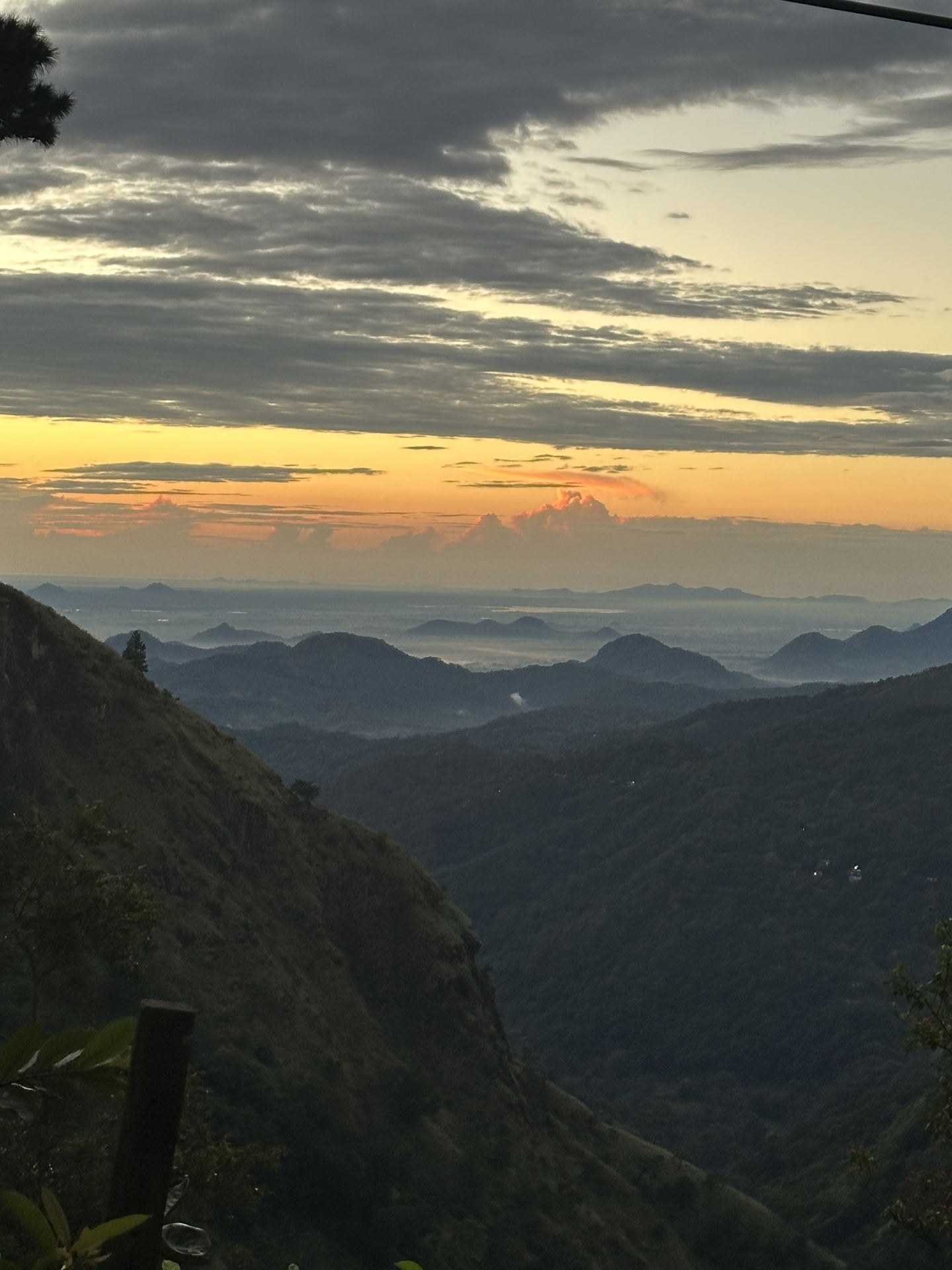 The ridge across the valley at sunset, layered hills going back into haze.